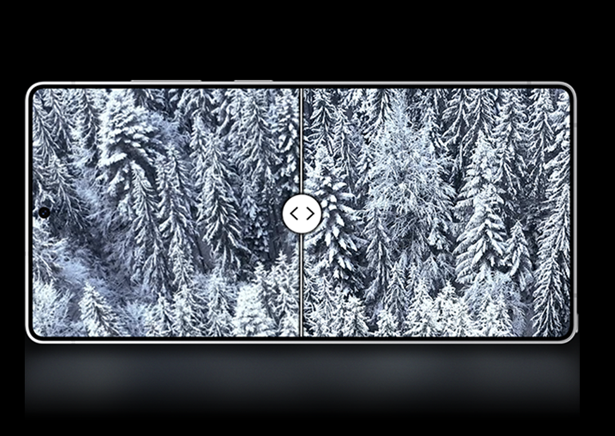 Scenic view of a snow covered forest on the screen of Samsung Galaxy S25 Ultra, highlighting half the screen with the original picture and half the screen with the enhanced image using ProScaler to make your photos sharper and brighter, with a display to match.
